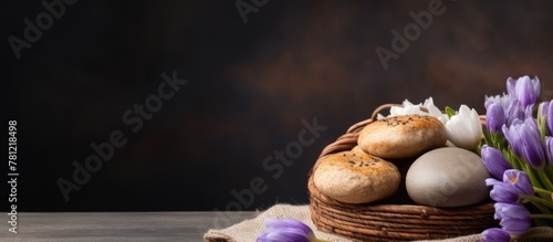 Basket of bread and blooms on table