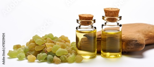 Bottle of oil near grapes
