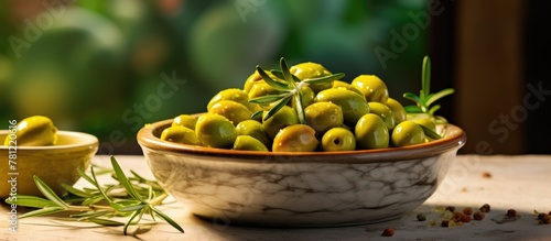 Olives and rosemary in a bowl