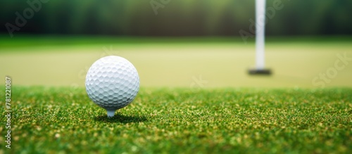 Golfer putting ball into ho...