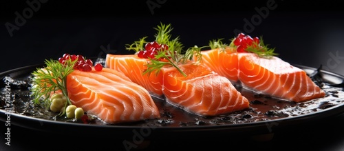 Close up of salmon fillets on plate with garnish