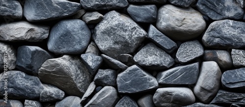Close-up pile rocks black background