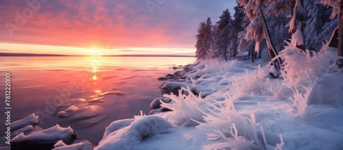 Sunset view of icy lake sho...