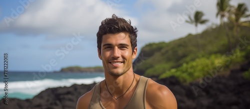 Man with surfboard on rocky...