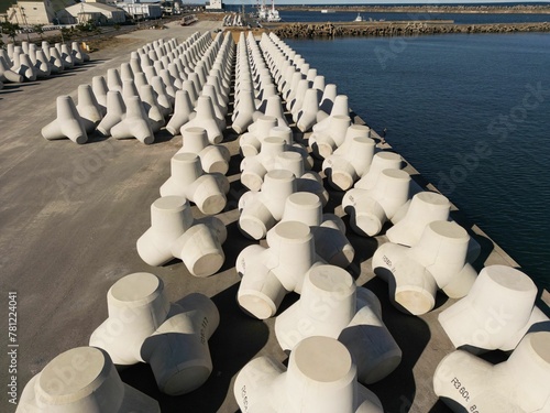 Group of tetrapods at the seashore in Japan on a sunny day photo