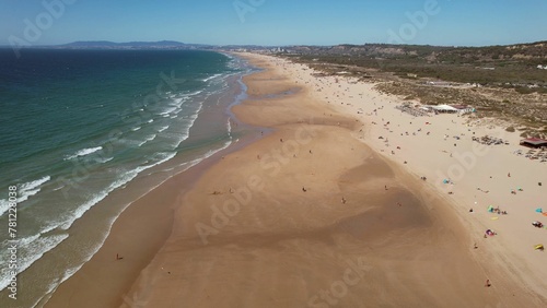 Drone view at Caparica Beach in Almada District, Greater Lisbon, Portugal on a summer day photo