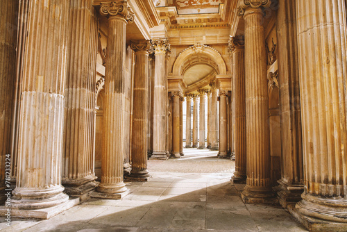 Картината върху платно An elegant corridor adorned with intricately designed columns and arches, bathed