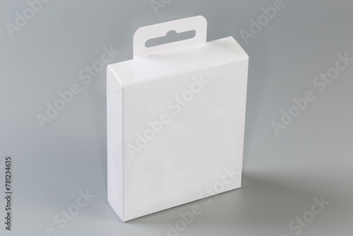 White rectangular cardboard hang tab packing box on gray surface © An-T