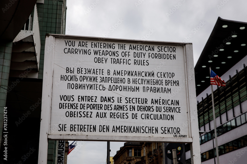 Foto de Historical text sign at the Checkpoint Charlie as a border of ...