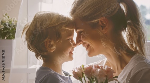 Son Gives Joyful Mother Flowers on Mother's Day photo