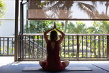 yoga retreat in Thailand or Bali, woman practices yoga and mindfulness meditation