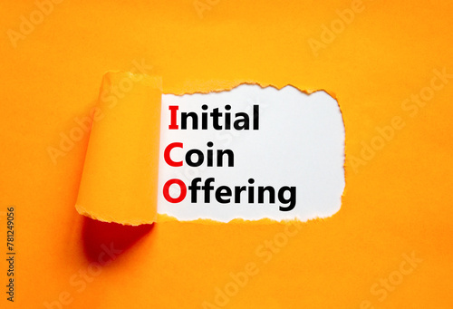 ICO initial coin offering symbol. Concept words ICO initial coin offering on beautiful white paper. Beautiful orange paper background. Business ICO initial coin offering concept. Copy space. photo