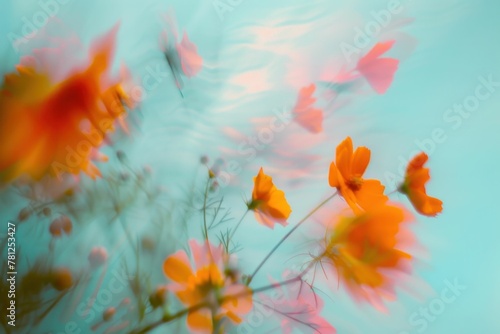 Beautiful Orange Flowers in a Dreamy Blue and Turquoise Water Background Reflecting Light and Tranquility