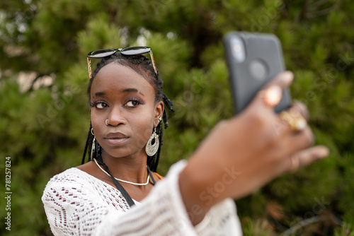 African American Girl Taking Selfie Outdoors photo