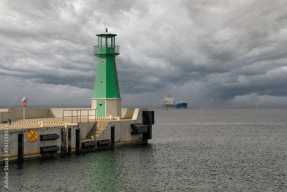 The Bay of Gdansk, the Baltic Sea. Entrance to the port of Gdansk, two lanterns indicating the waterway for ships The Bay of Gdansk, the Baltic Sea. Entrance to the port of Gdansk, two lanterns indicating the waterway for ships