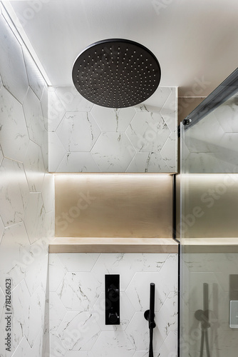 Modern bathroom with marble tiles and rain showerhead