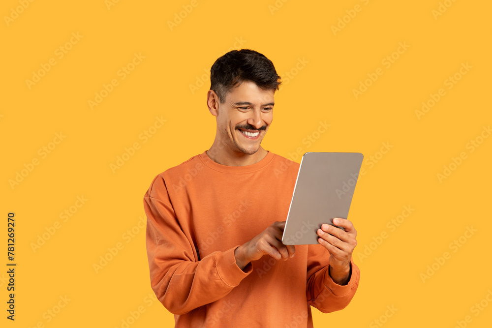 Man with a tablet and happy expression Man with a tablet and happy expression