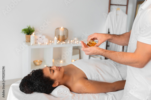 Εκτύπωση καμβά Essential oils being poured for massage in spa