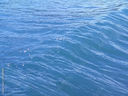 Blue water surface with ripples. 