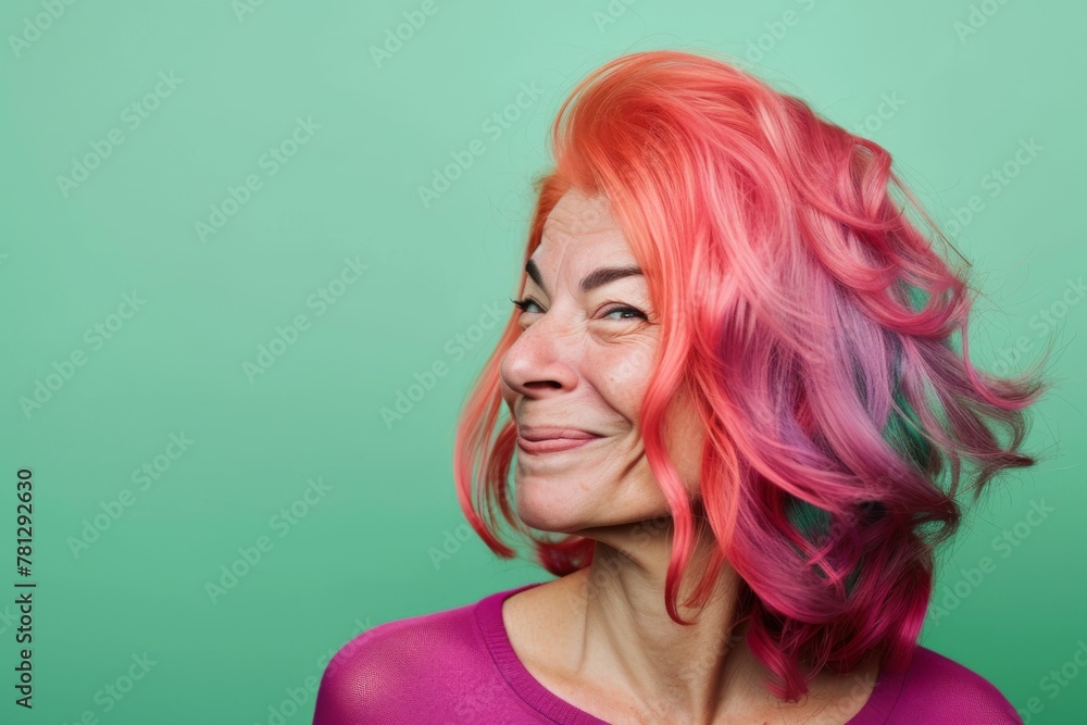 Vibrant Rainbow Hair Woman Against Green Background. Vibrant Rainbow Hair Woman Against Green Background.