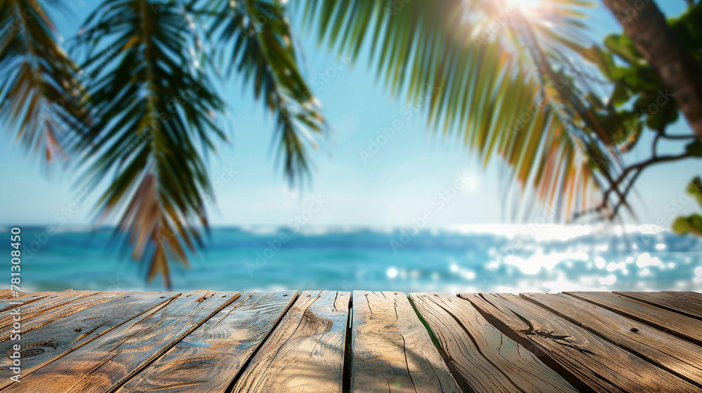 Abstract blurred background of wooden table top with palm leaves and blue sea in the summer