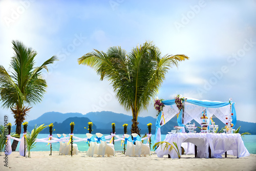 Prepare a wedding ceremony at beach front. Outdoor wedding ceremony with amazing scenery of the sea.