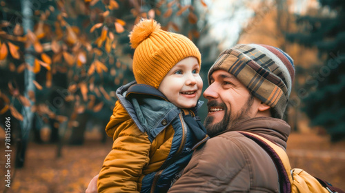 Joyful embrace between father and child in autumnal glow, the laughter and bond echoing warmth and familial love. Banner. Copy space