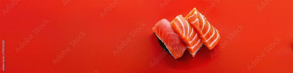 A close-up of pieces of sushi on red background, Concept for Food Magazine, Japanese Cuisine Promotion, Menu, Poster, Banner A close-up of pieces of sushi on red background, Concept for Food Magazine, Japanese Cuisine Promotion, Menu, Poster, Banner