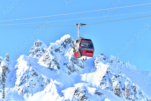 Ski lift over the slopes of Courchevel ski resort, French alps