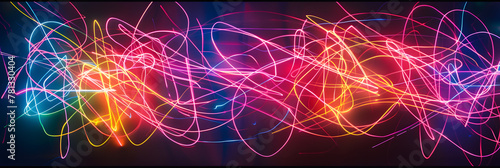 Colorful neon streaks of light, created by glow sticks, illuminate the darkness in an abstract and vibrant display. The lines twist and turn, creating a mesmerizing and dynamic visual experience. photo