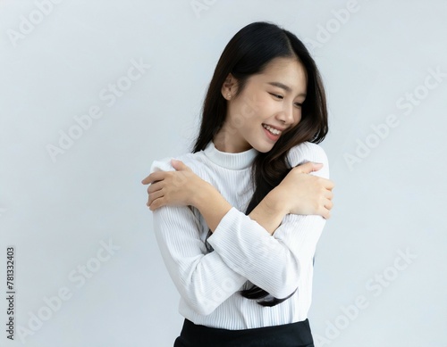 Portrait of a beautiful young asian woman smiling isolated on white background
