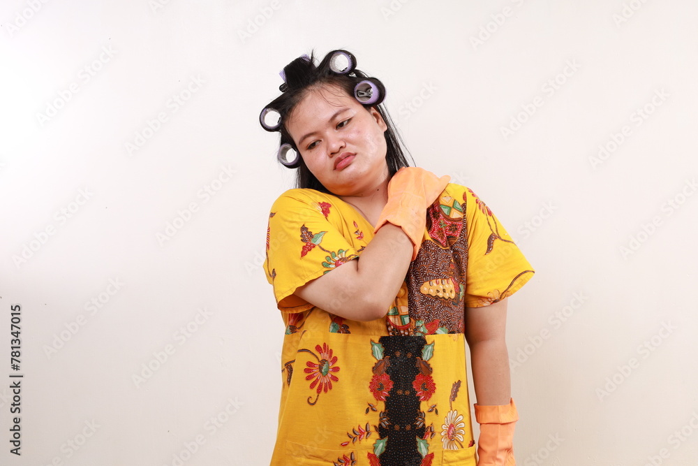 Asian housekeeper woman having problem with her shoulder Asian housekeeper woman having problem with her shoulder
