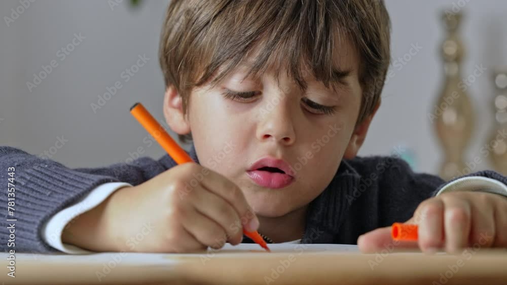 Super Focused Little Boy Coloring His Sketchbook With His Colored Marker Super Focused Little Boy Coloring His Sketchbook With His Colored Marker