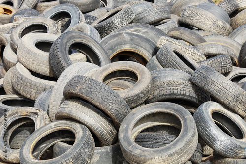 A junkyard pile of old car tires, Film grain effect