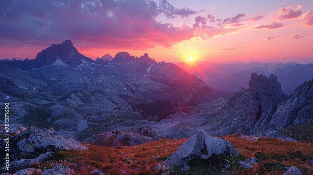 The sun dipped below the horizon, casting a warm glow over the rugged peaks, painting the sky in hues of orange and pink.