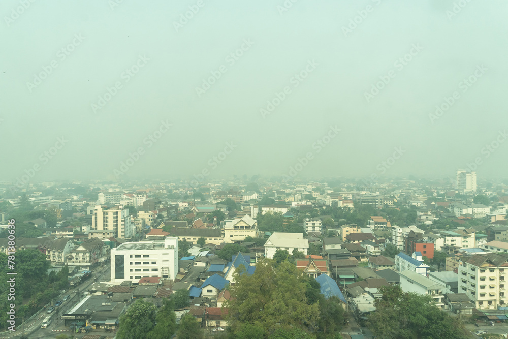 Bad air pollution with PM 2.5 (fine particulate matter) dust smog problem over Chiangmai city landscape skyline background aerial view, dangerous for human health and respiration, risk of lung cancer