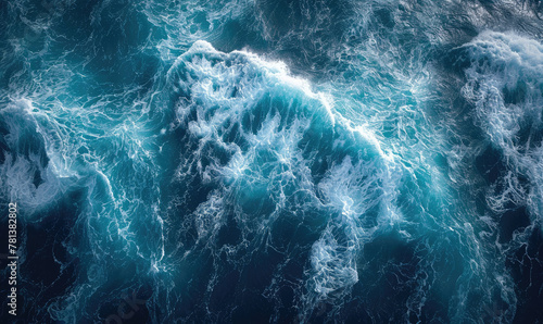 Aerial view to ocean waves. Blue water background photo