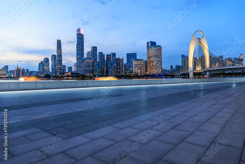 Empty square floors with modern buildings at night in Guangzhou