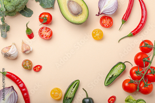 Colourful vegetables on beige background photo