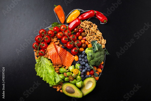 Fruit and vegetables arrangement in realistic heart shape photo