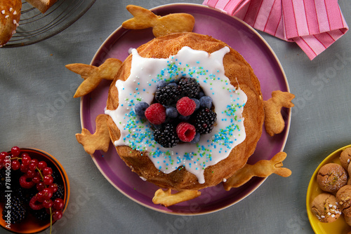 Easter cake with sugar icing and fresh berries photo