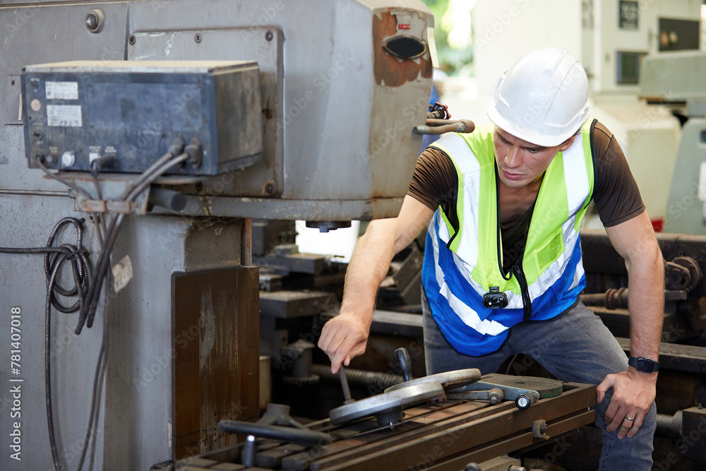 engineer or factory workers checking and control lathe machine in factory engineer or factory workers checking and control lathe machine in factory