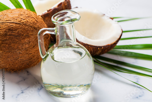 Bottle of coconut oil and f...
