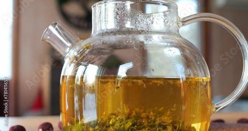 Freshly brewed slimming herbal tea in glass teapot. Beverage for those aspiring for slender figure. Experience benefits of slimming tea for weight loss journey. Ideal figure concept