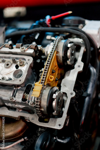 close up At the service station there is dirty motor in a suspended state for replacement of parts and repairs