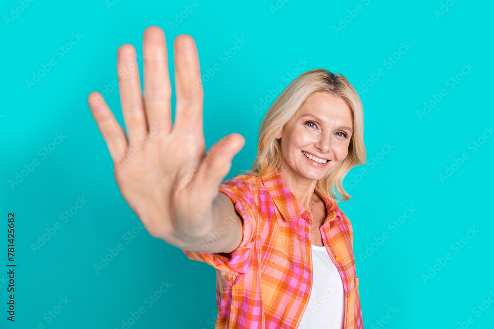 Photo of satisfied nice woman with straight hairstyle dressed checkered shirt give you highfive isolated on turquoise color background Photo of satisfied nice woman with straight hairstyle dressed checkered shirt give you highfive isolated on turquoise color background