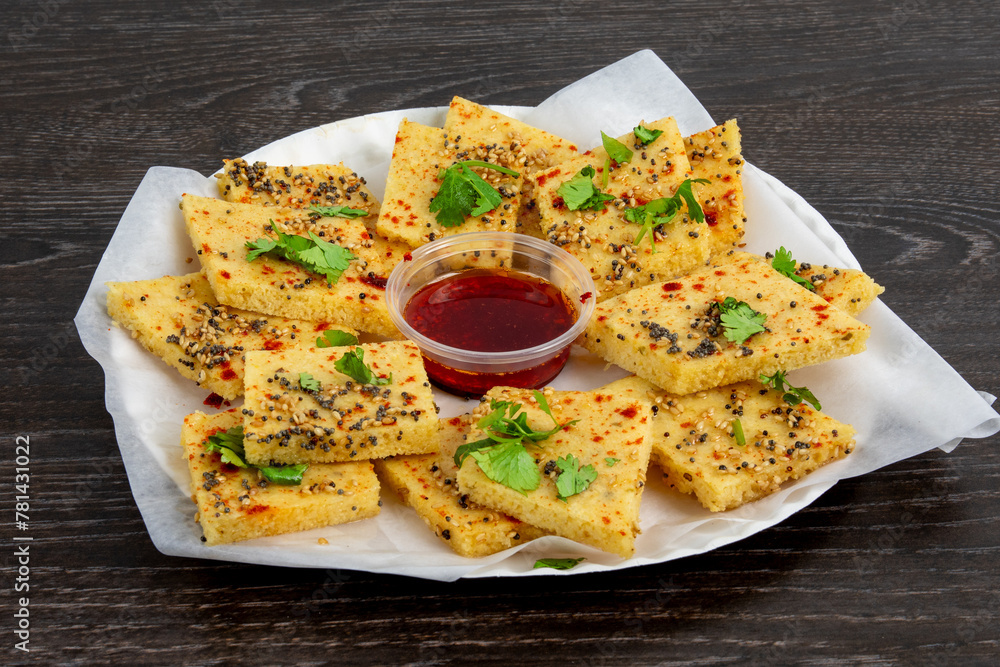 A plate of traditional Indian or Pakistani snack Khaman or yellow dhokla A plate of traditional Indian or Pakistani snack Khaman or yellow dhokla