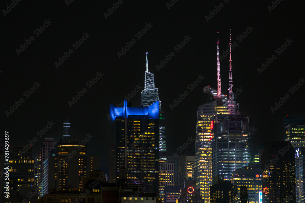 Buindings and skyscrapers at night in New York City (USA)