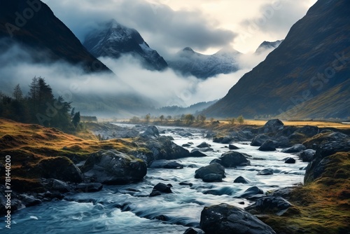 Autumn landscape of mountain slopes with yellow trees, river and foggy haze. The concept for the development of tourism, mountaineering, skiing, rock climbing, excursions in the mountains. 