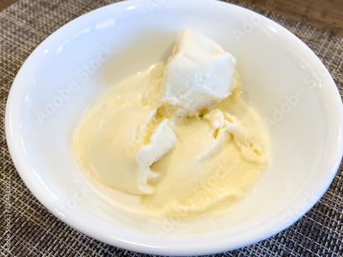 Vanilla homemade ice cream in a white bowl